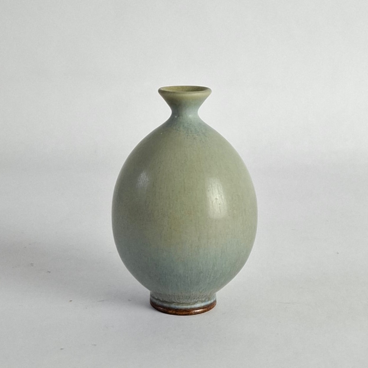 Small vase with blue/grey glaze.
