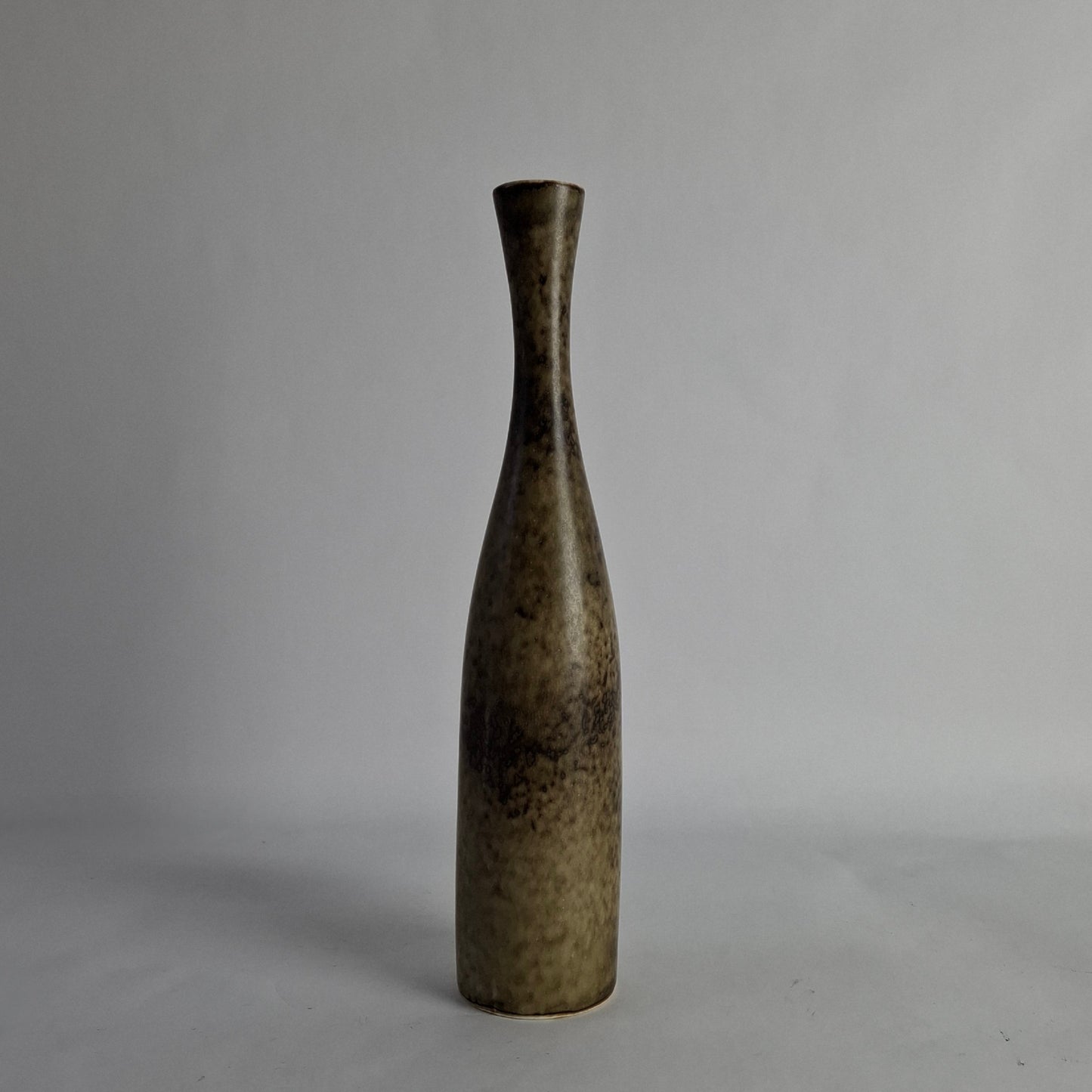 Stoneware vase with mottled brown glaze.
