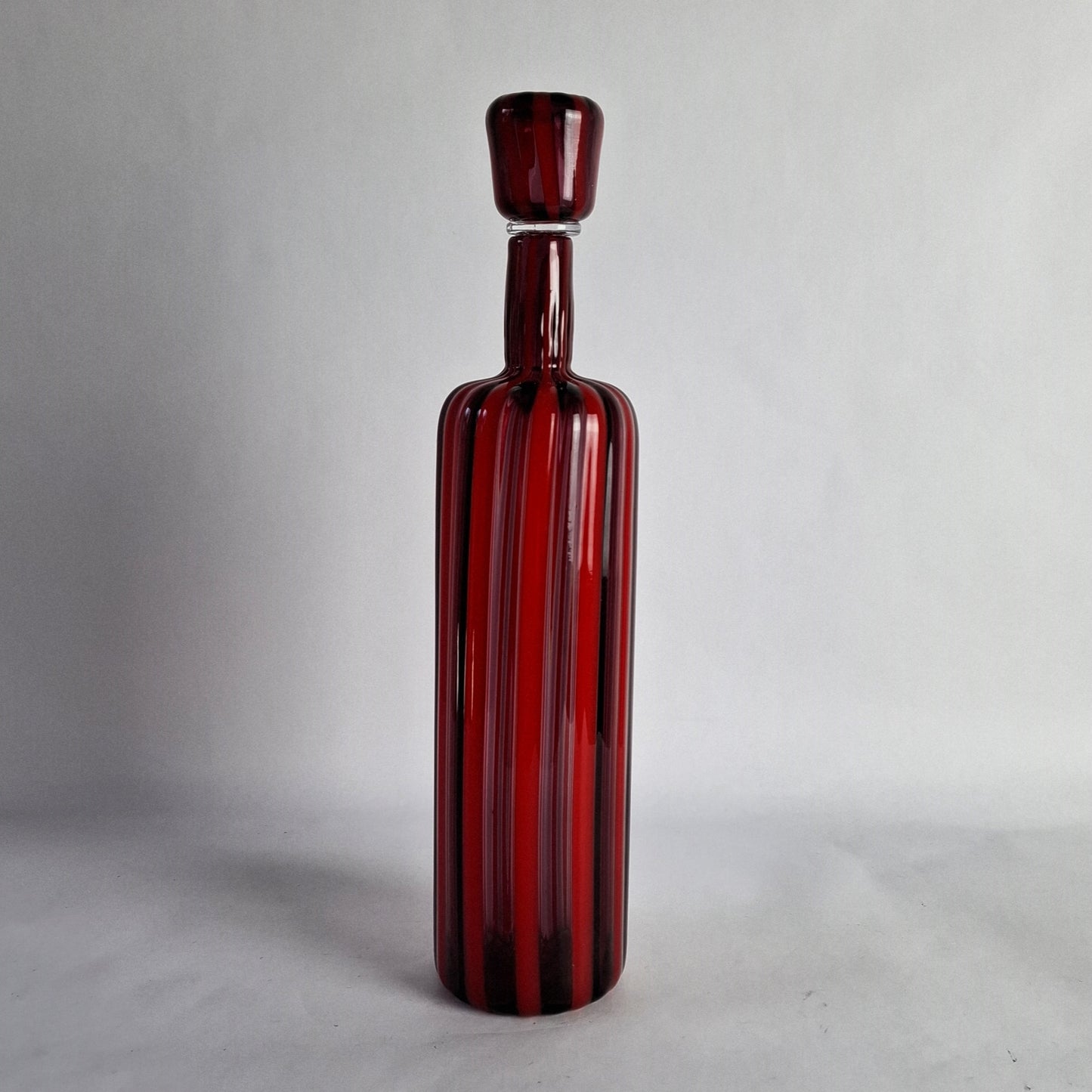 Decanter in red and violet glass canes.