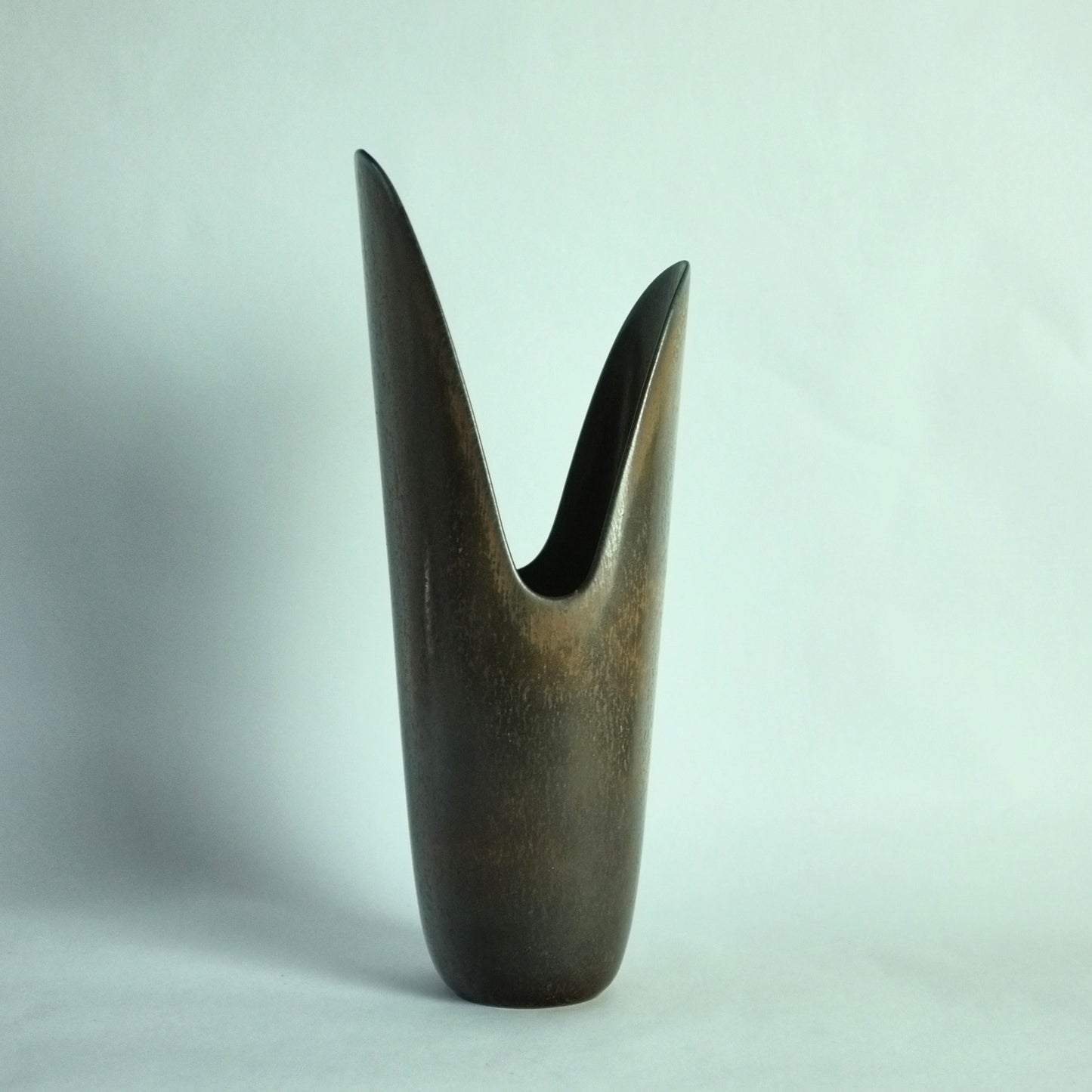 Stoneware vase in asymmetric pike's jaw shape.