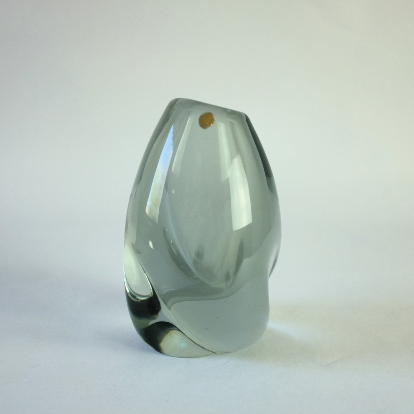 Thick glass vase with internal smoke haze decoration in asymmetric form.