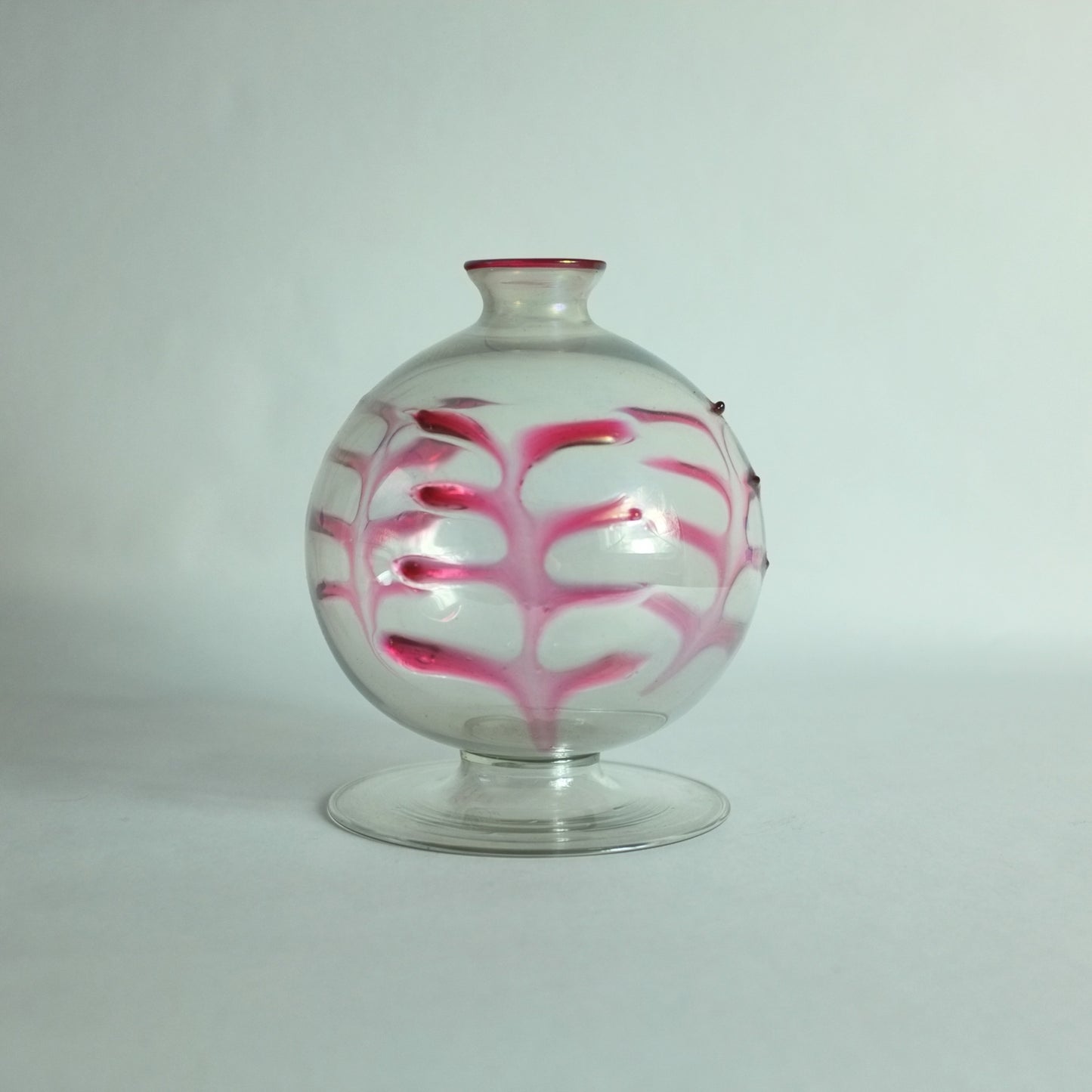 Rare vase with applied palm leaf decoration on spherical body an a flat, round foot.