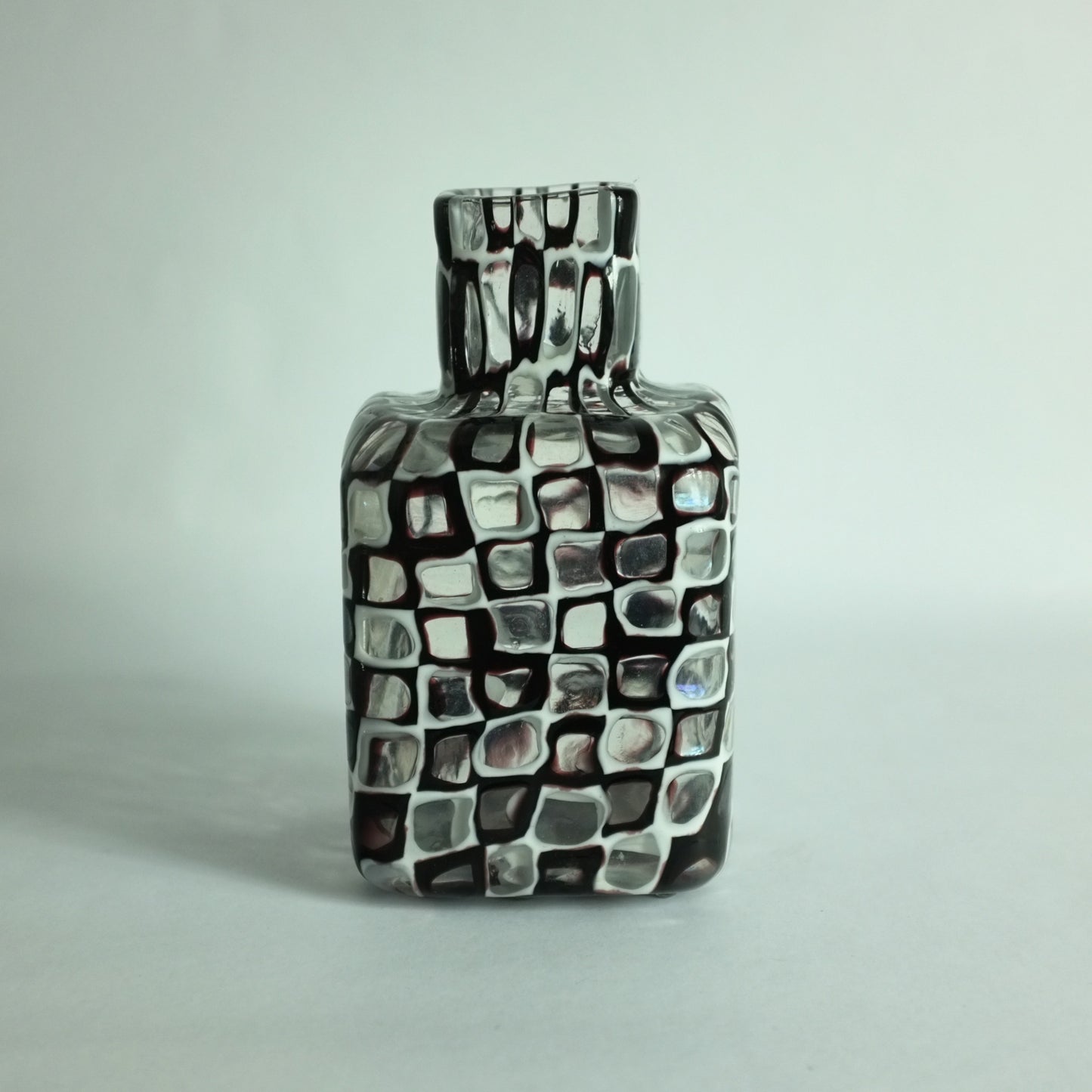 An 'Occhi' or 'eyes' vase with alternating black and white murrines by Tobia Scarpa for Venini glass company.