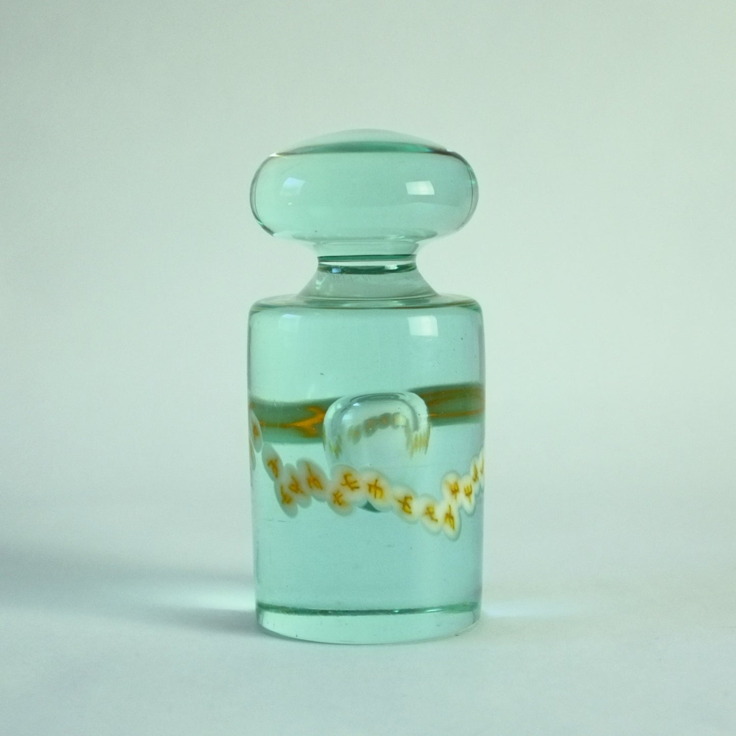 Paperweight in light aqua, internal bubble and band of murrines.