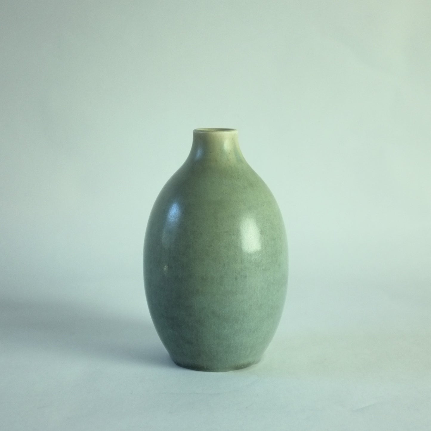 A pale grey/blue stoneware vase.
