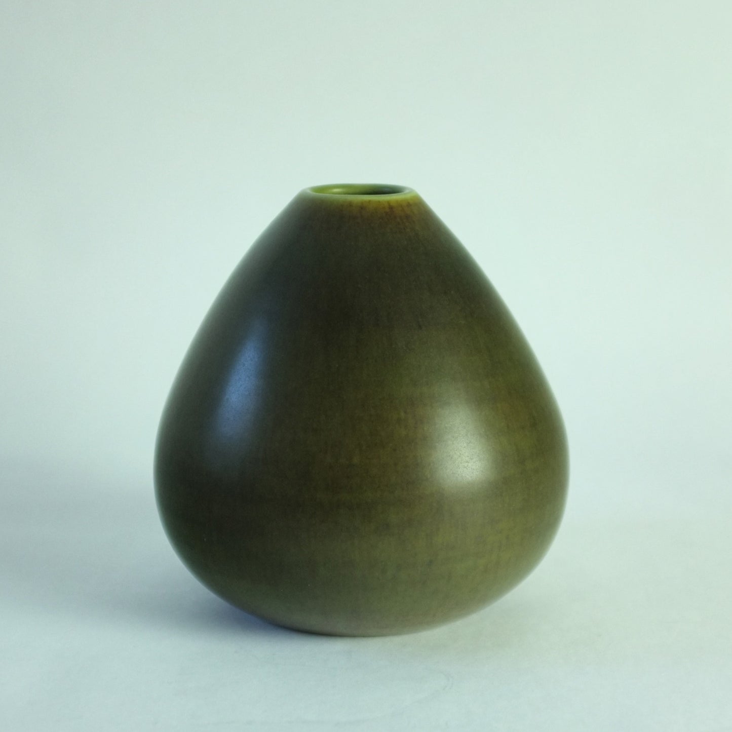 Rounded conical vase with green glaze.