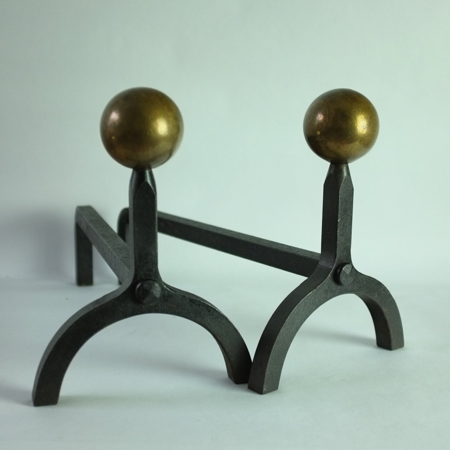 Modernist andirons in iron and brass. 1930s/40s.