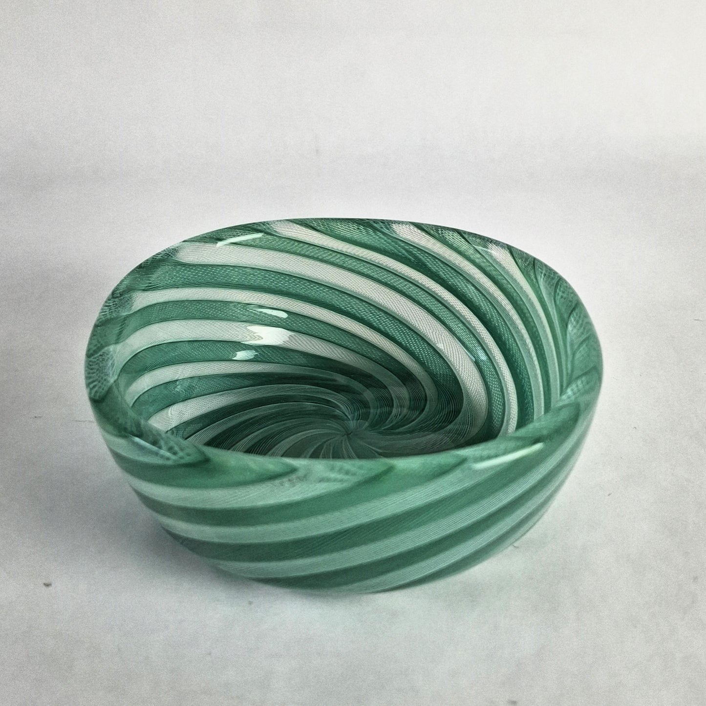 Small bowl with alternating green and white zanfirico canes by Paolo Venini.