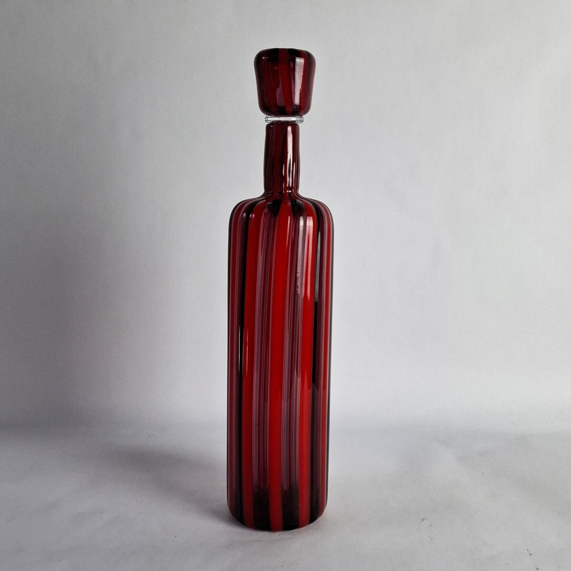 Decanter in red and violet glass canes.