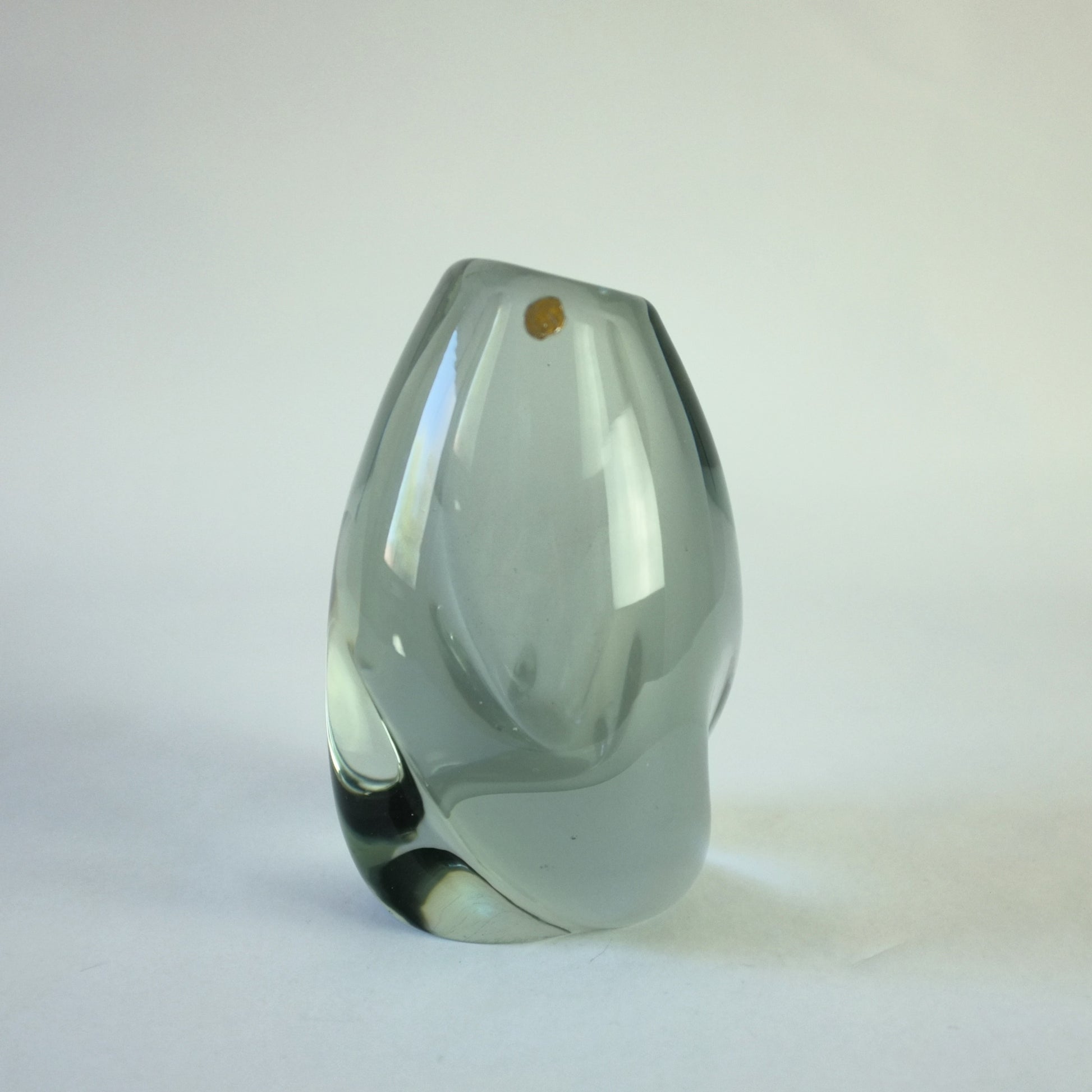Thick glass vase with internal smoke haze decoration in asymmetric form.