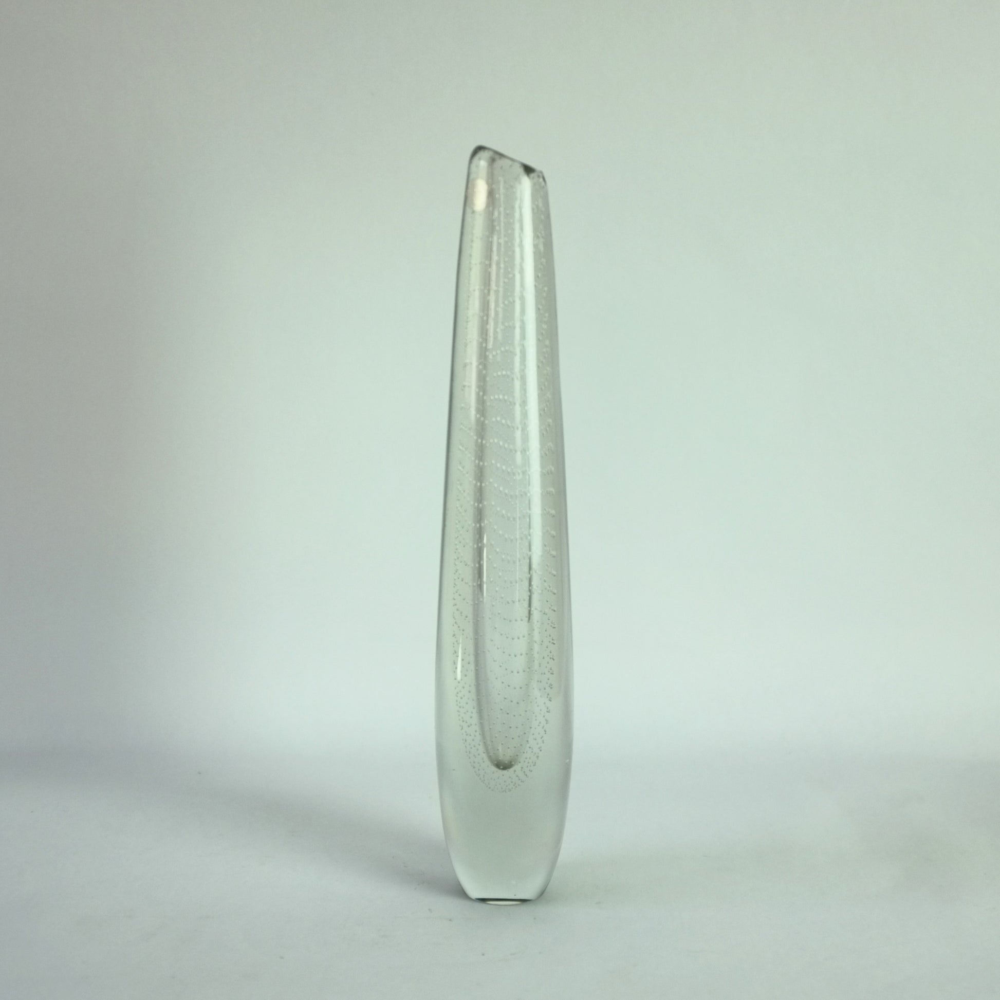 A clear glass vase with internal controlled bubble decoration.