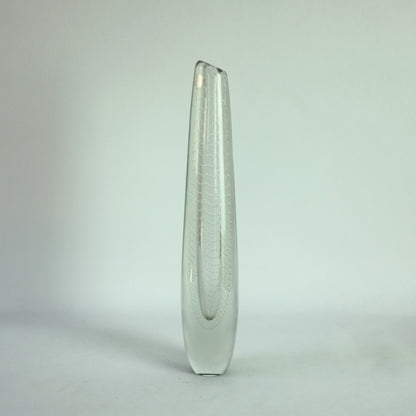 A clear glass vase with internal controlled bubble decoration.