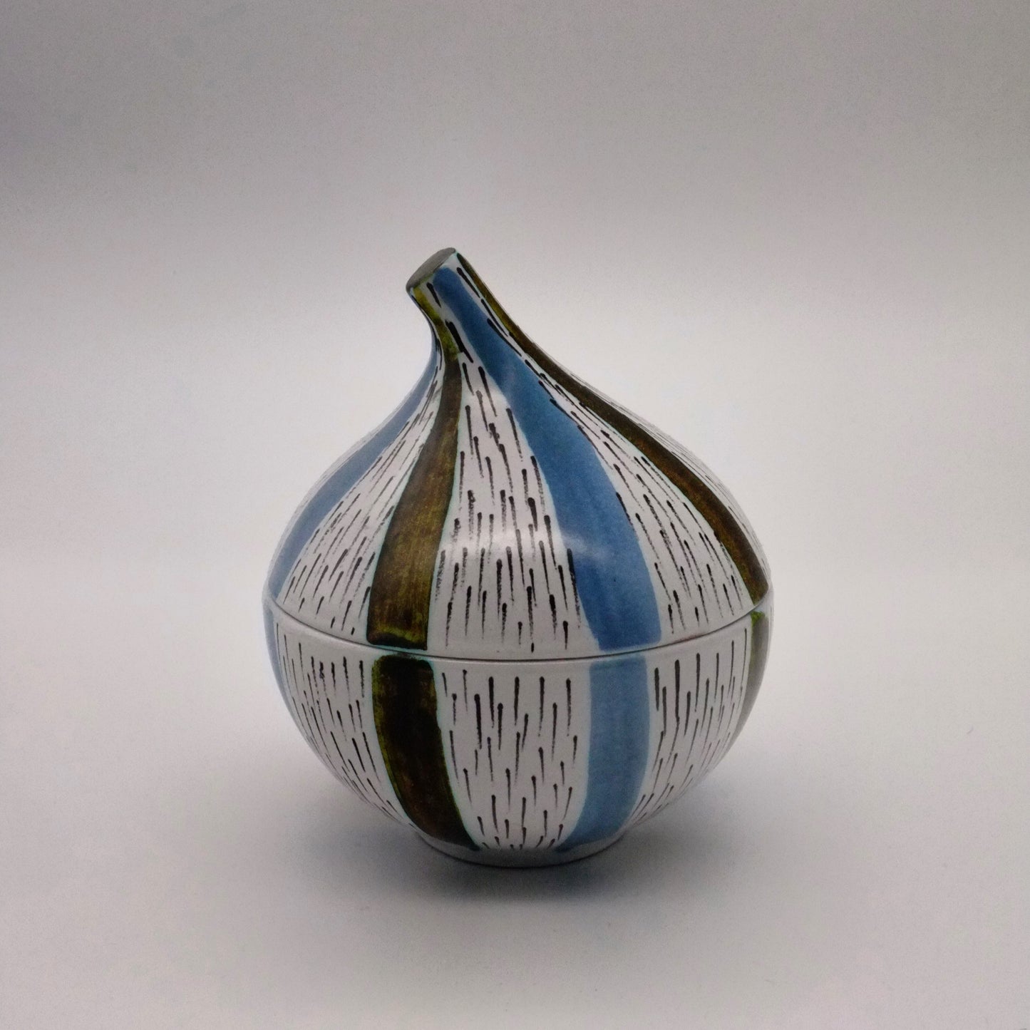 Onion shaped faince bowl with cover.
