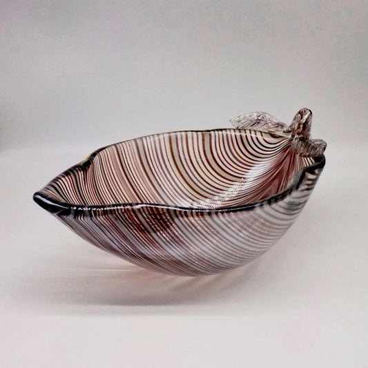 A large, deep glass bowl with amethyst and white pulled thread decoration, featuring small tool-worked leaves and an iridized lustre finish.