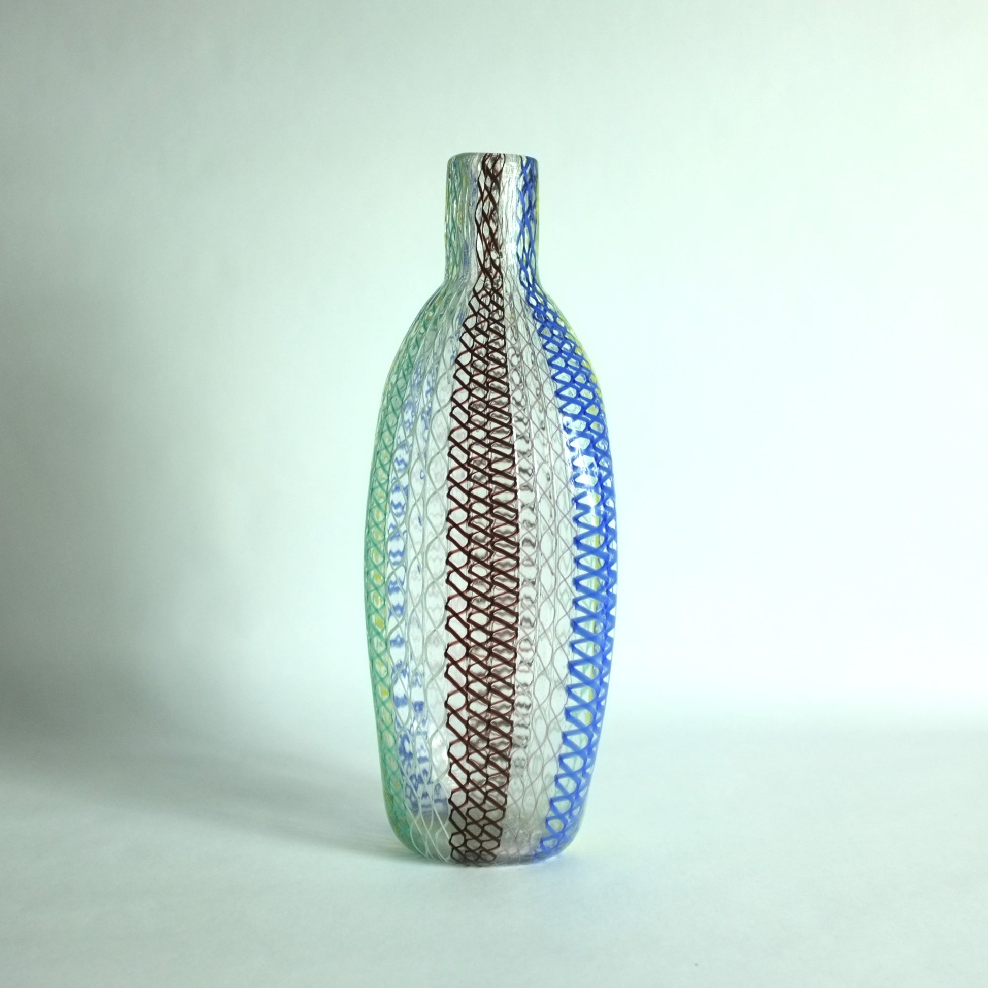 A tall shouldered multicolored glass vase with alternating vertical zanfirico canes designed by Dino Martens for Aureliano Toso, Murano, Italy.