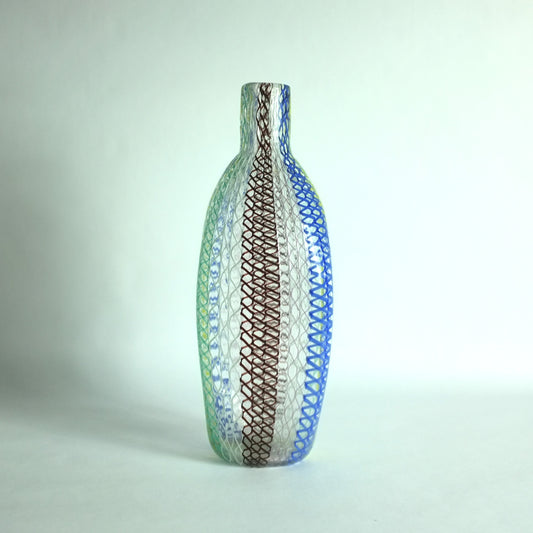 A tall shouldered multicolored glass vase with alternating vertical zanfirico canes designed by Dino Martens for Aureliano Toso, Murano, Italy.