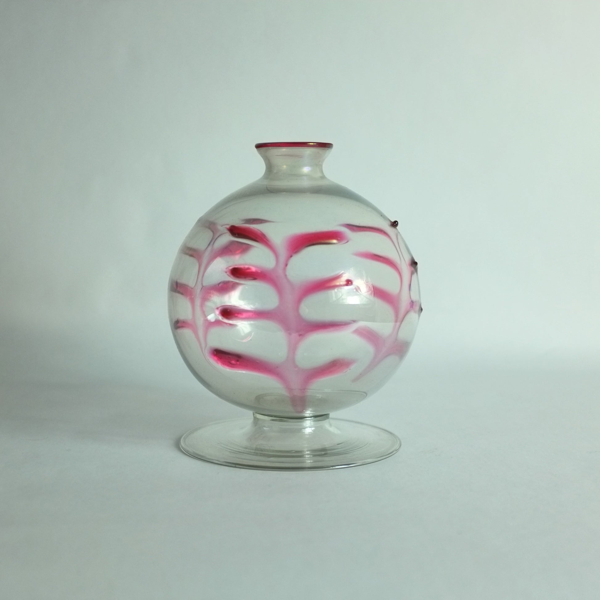 Rare vase with applied palm leaf decoration on spherical body an a flat, round foot.