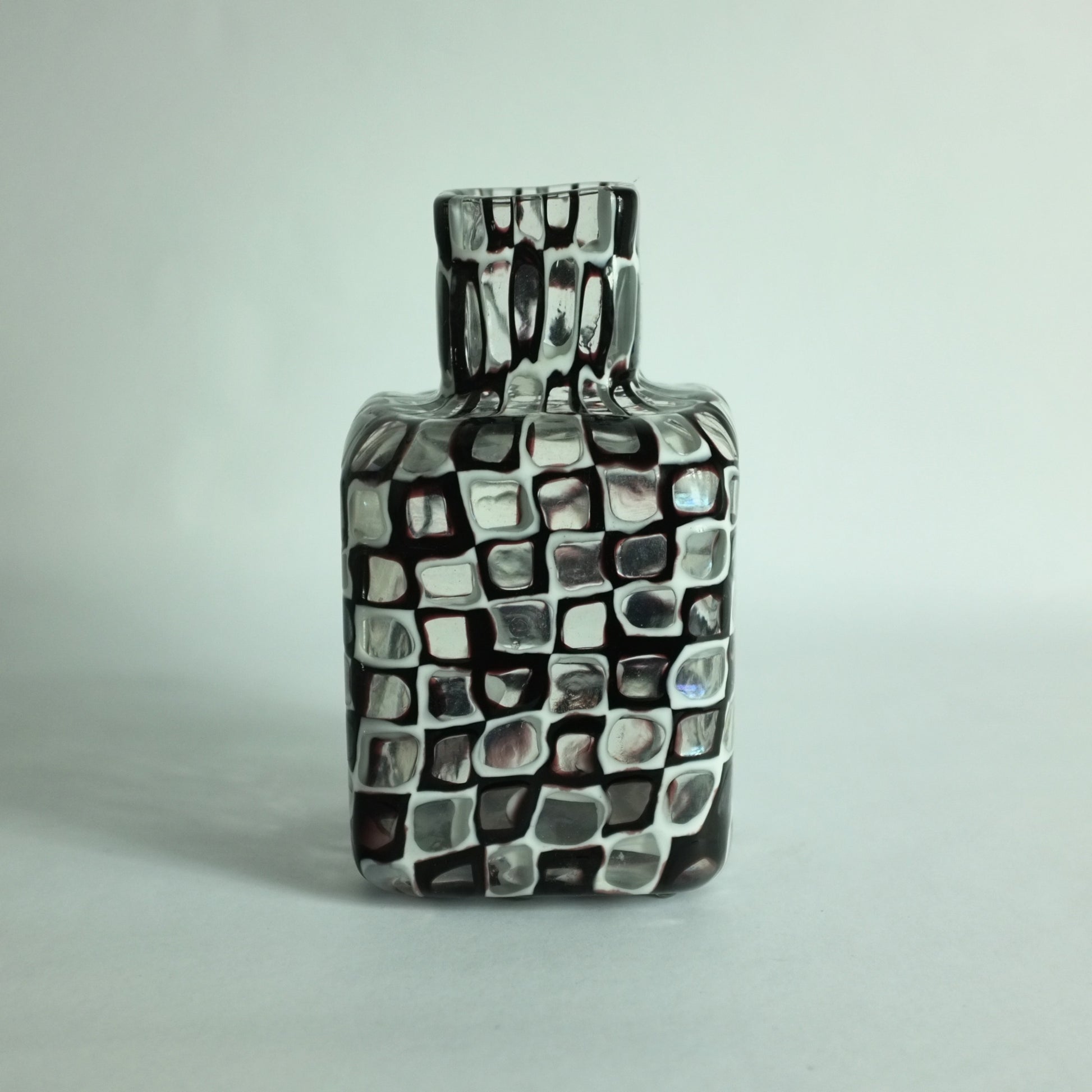 An 'Occhi' or 'eyes' vase with alternating black and white murrines by Tobia Scarpa for Venini glass company.