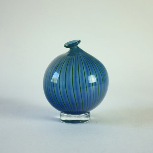 Spherical vase with blue and green vertical strpe decoration.
