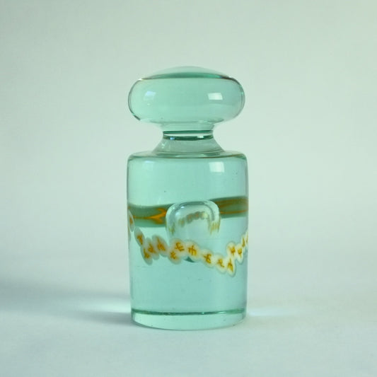 Paperweight in light aqua, internal bubble and band of murrines.