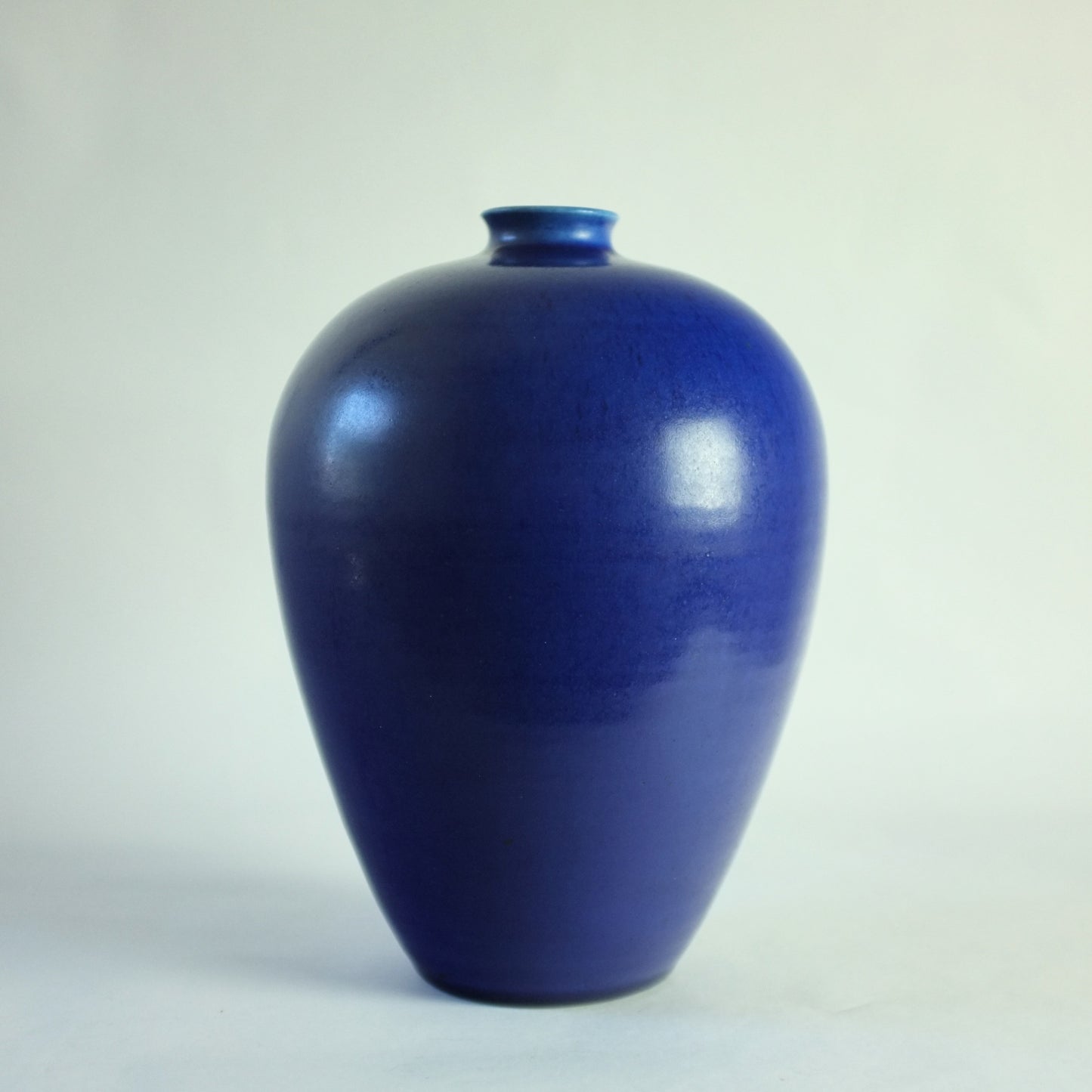 Stoneware vase with vivid blue glaze.