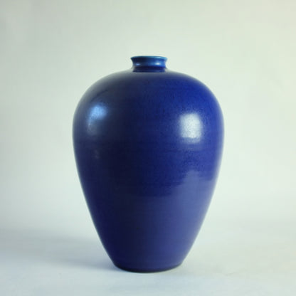 Stoneware vase with vivid blue glaze.