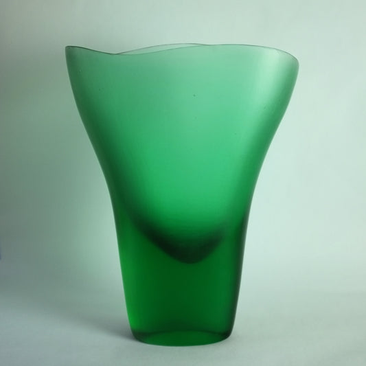 A green glass vase with a matte "battuto" finish, designed by Tobia Scarpa.