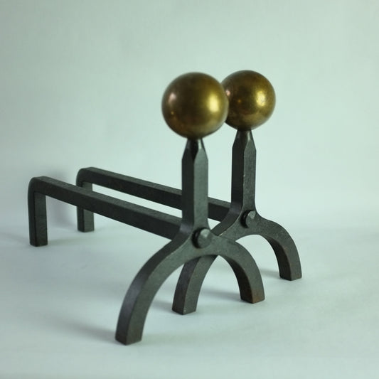 A pair of vintage modernist wrought iron andirons with brass ball finials.