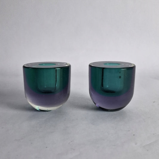 A pair of glass sommerso candlesticks in green and amethyst designed by Flavio Poli for Seguso Vetri D'Arte.