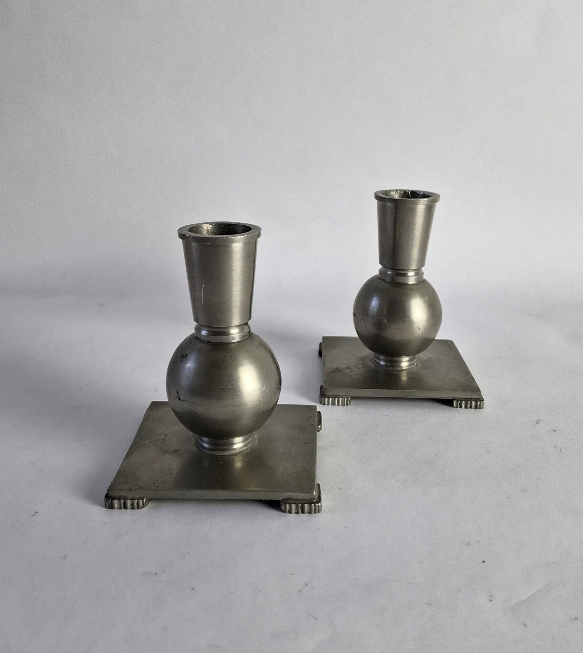 A pair of pewter candlesticks in Swedish grace style.