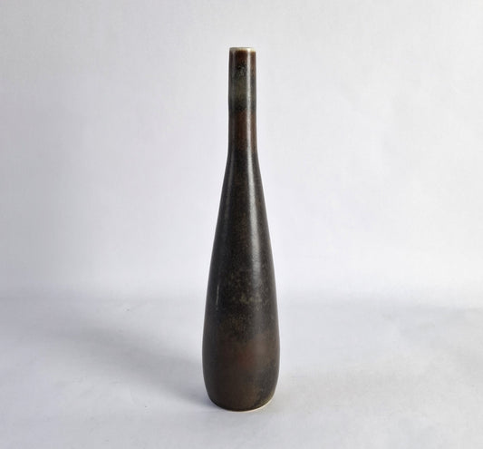 A stoneware vase with a mottled dark brown glaze.