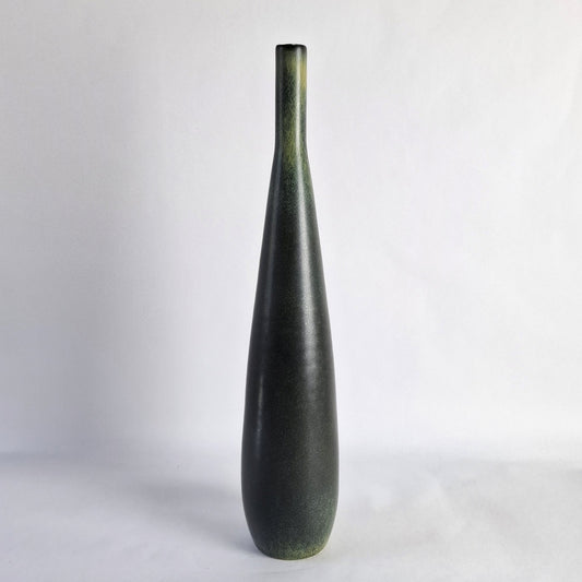 A tall, slender stoneware vase.