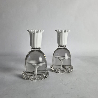A pair of white and clear glass candlesticks with floral design, designed by Paolo Venini.