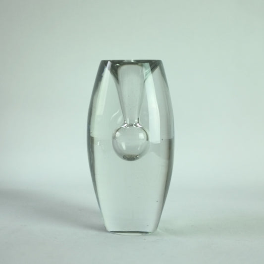 A clear glass vase with a waisted form with steam blown internal bubble.