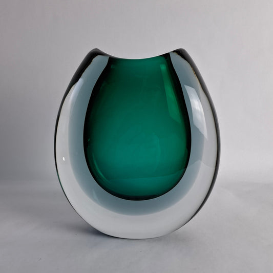A rare sommerso vase with flattened round shape and submerged colors, featuring green, grey, and clear glass, designed by Vicke Lindstrand for Kosta, Sweden.